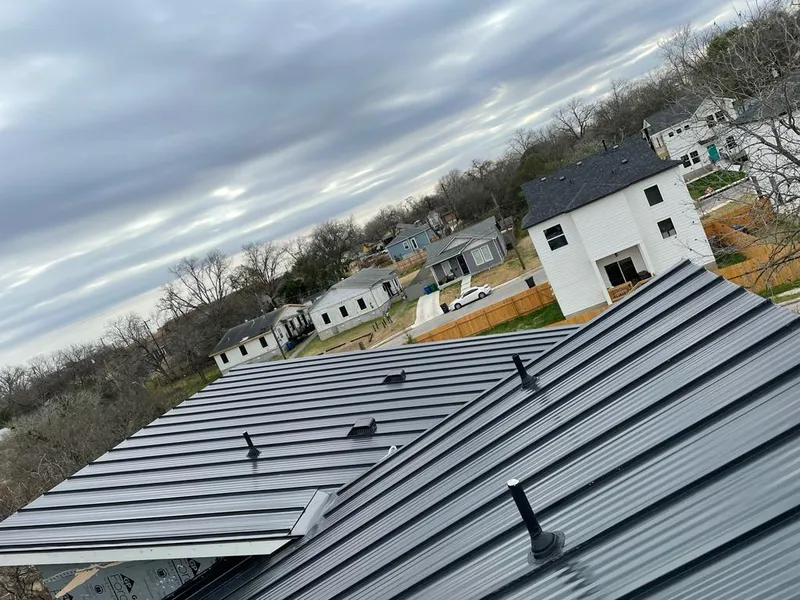 Standing seam metal roof panels with vents for Skylight Repair in Ashland